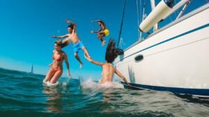 Top 5 Greek Islands for Families on a Catamaran - children jumping from a catamaran